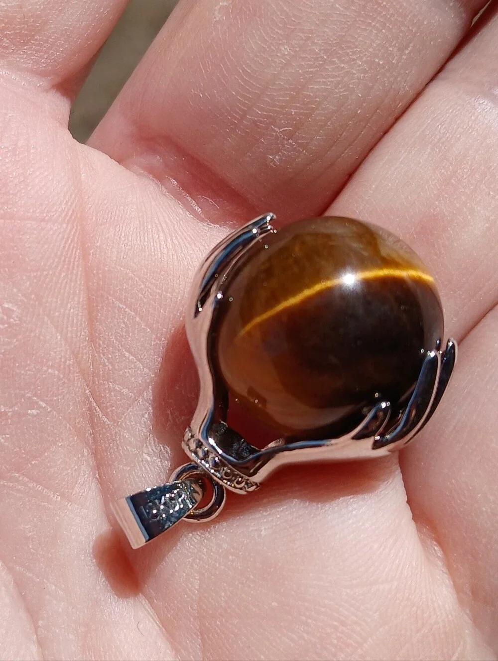 New 18K Hands Holding Tiger Eye Sphere Pendant.